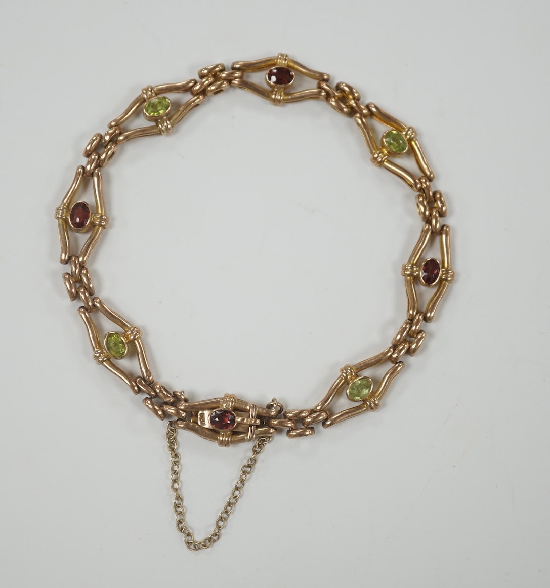 An Edwardian 9ct and gem set open link bracelet, 18cm, gross weight 9.3 grams.